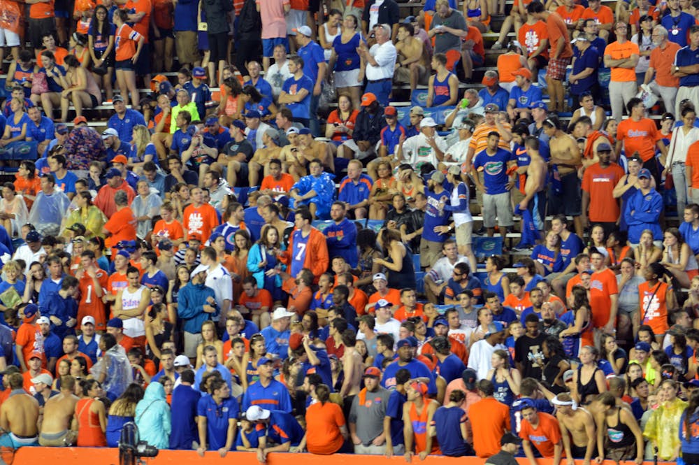 <p>Fans wait out the weather delay during Florida's suspended game against Idaho at Ben Hill Griffin Stadium on Saturday night. The game was announced a no contest on Wednesday.</p>
