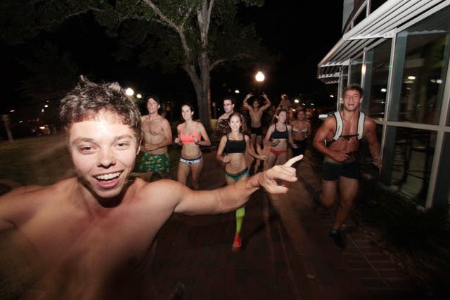 Scantily clad students sprint through Turlington Plaza on Friday evening for 14th annual Great Underwear Dash.
