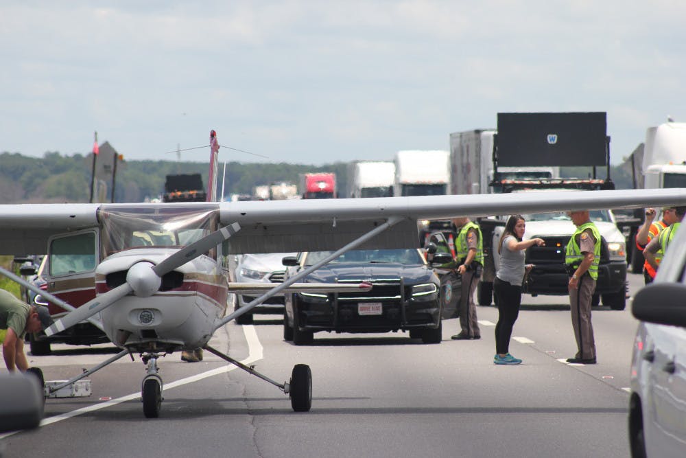<p>Law enforcement officials moved a plane off the northbound lanes of Interstate 75 after it made an emergency landing this afternoon.</p>