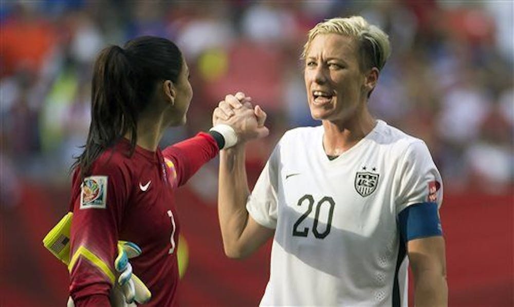 <p>United States' Abby Wambach (20) celebrates her team's win with goalkeeper Hope Solo following the second half of a FIFA Women's World Cup soccer match on June 16, 2015 in Vancouver, New Brunswick, Canada.&nbsp;</p>