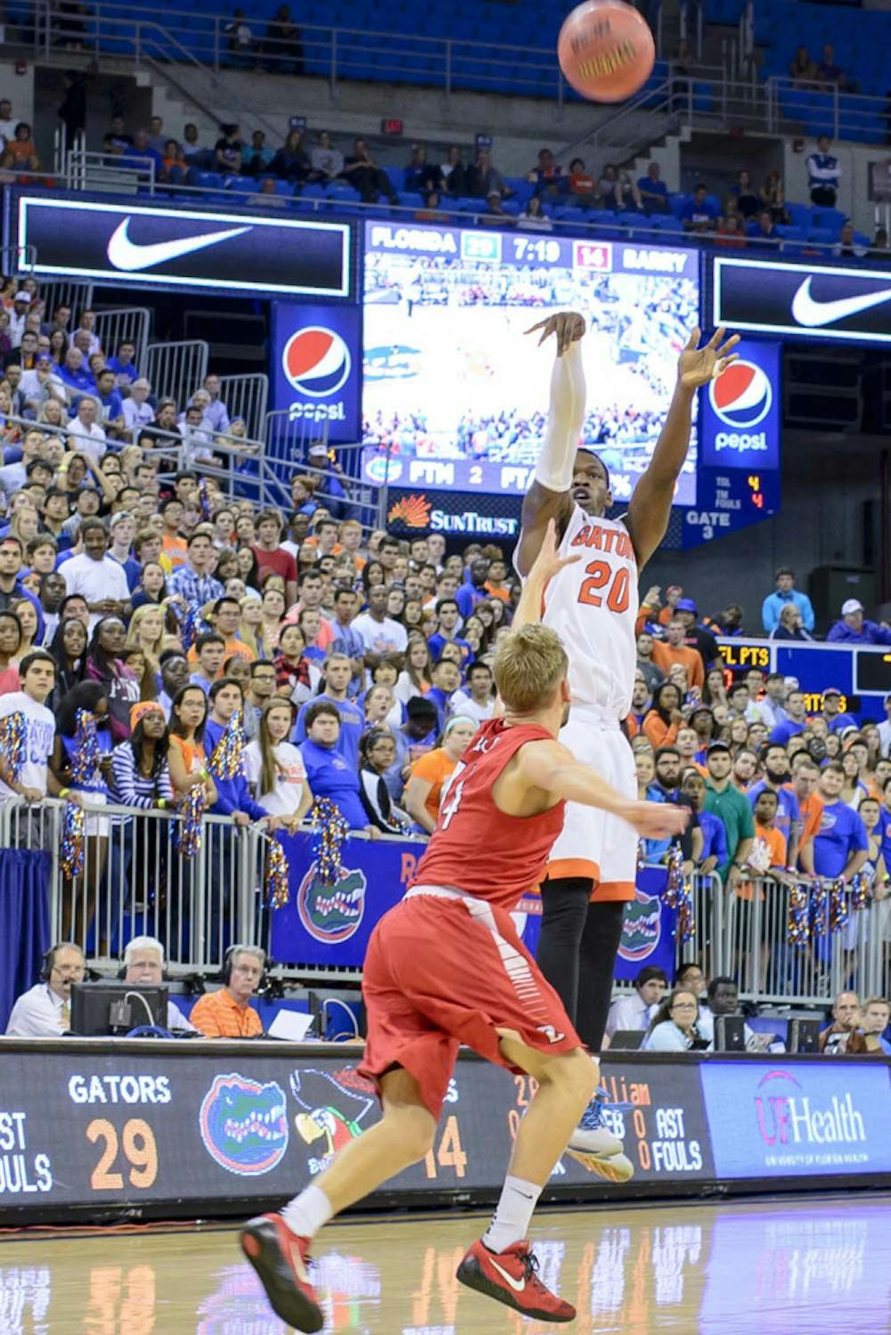 <p>Michael Frazier II attempts a three-point shot during Florida's 79-70 exhibition win against Barry on Nov. 6.</p>