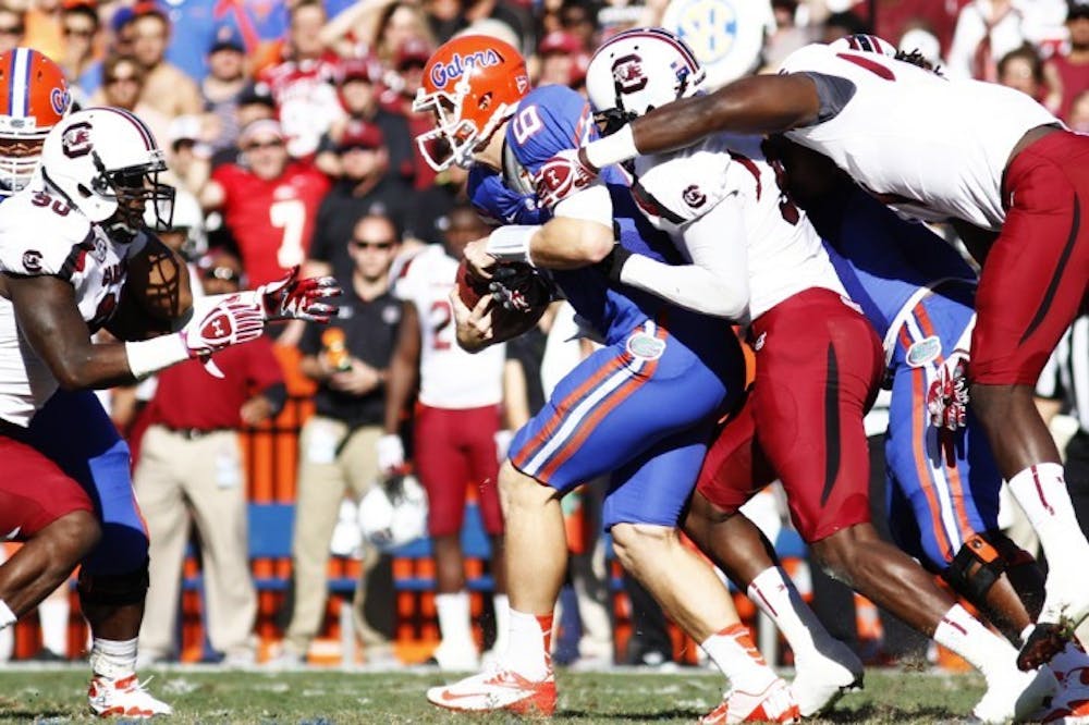 <p><span>Jeff Driskel gets sacked during UF’s 44-11 win against South Carolina on Saturday in The Swamp. Although Driskel failed to eclipse 100 passing yards for the third straight game, he has only one interception in 2012.</span></p>
<div><span><br /></span></div>