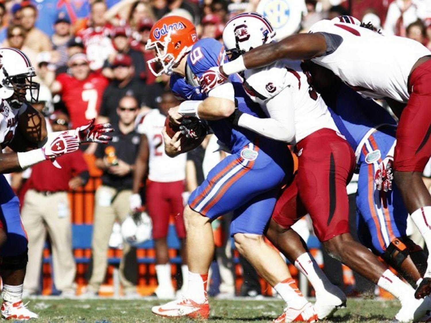 Jeff Driskel gets sacked during UF’s 44-11 win against South Carolina on Saturday in The Swamp. Although Driskel failed to eclipse 100 passing yards for the third straight game, he has only one interception in 2012.
