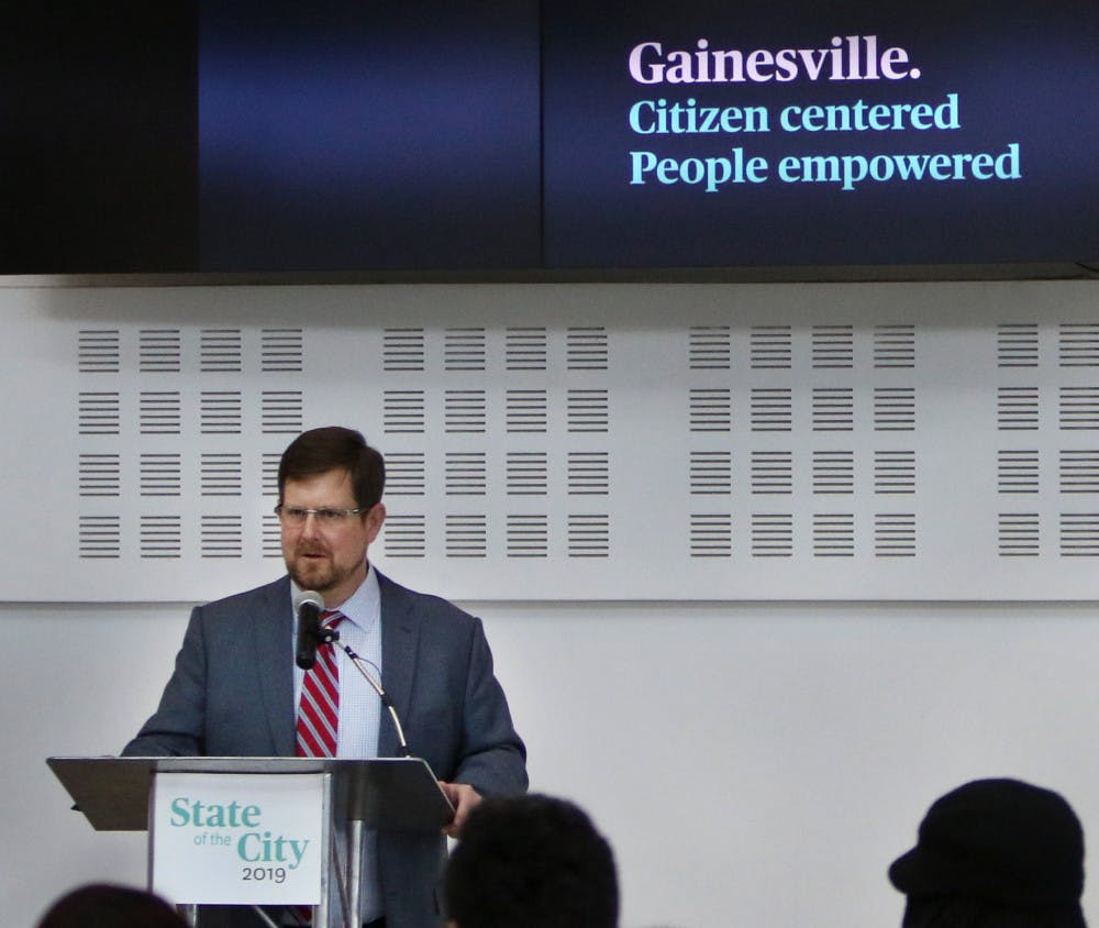 Gainesville Mayor Lauren Poe speaks to about 100 attendees Wednesday during the 2019 State of the City address at the Cade Museum for Creativity and Invention in downtown Gainesville. “As we begin to celebrate our city’s 150th anniversary, we commit to learning from our past in order to foster a greater future for ourselves and our posterity,” Poe said. The event also included speeches from Deborah Bowie, the interim city manager, and Ed Bielarski, the general manager of Gainesville Regional Utilities.