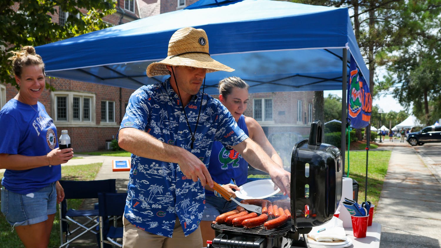 Tailgater Dane Ullian grills hotdogs off of West University Avenue before Florida’s matchup with Utah Saturday, Sept. 3, 2022.