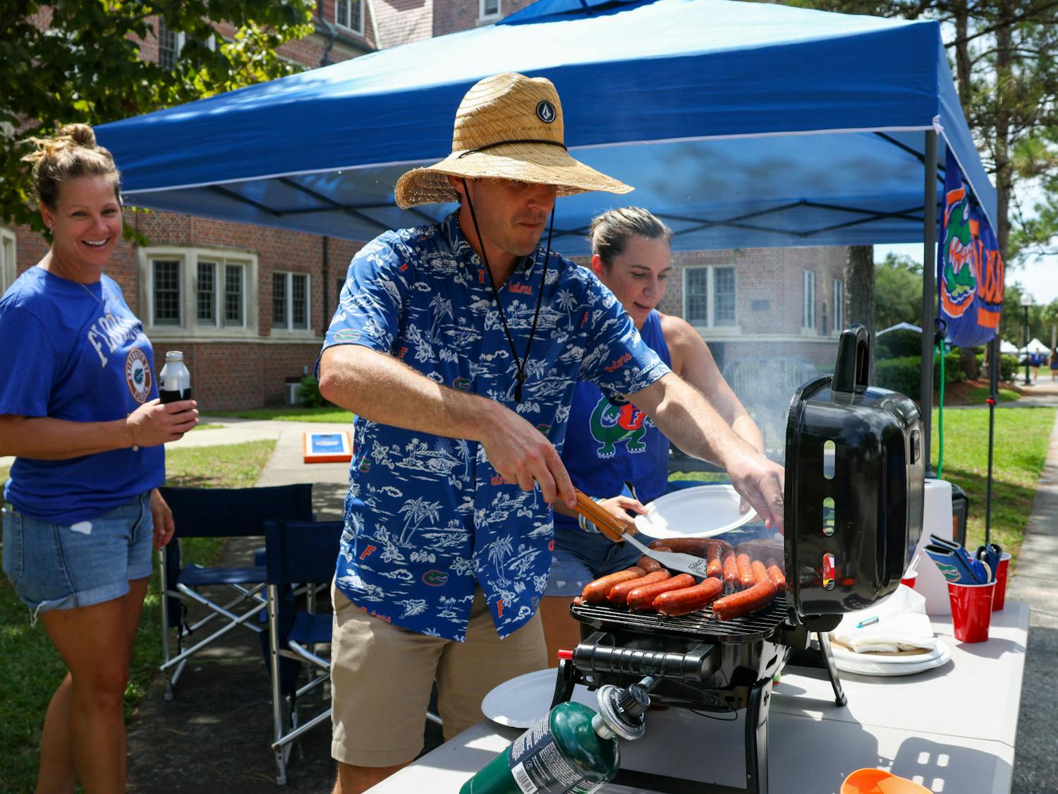 Tailgater Dane Ullian grills hotdogs off of West University Avenue before Florida’s matchup with Utah Saturday, Sept. 3, 2022.