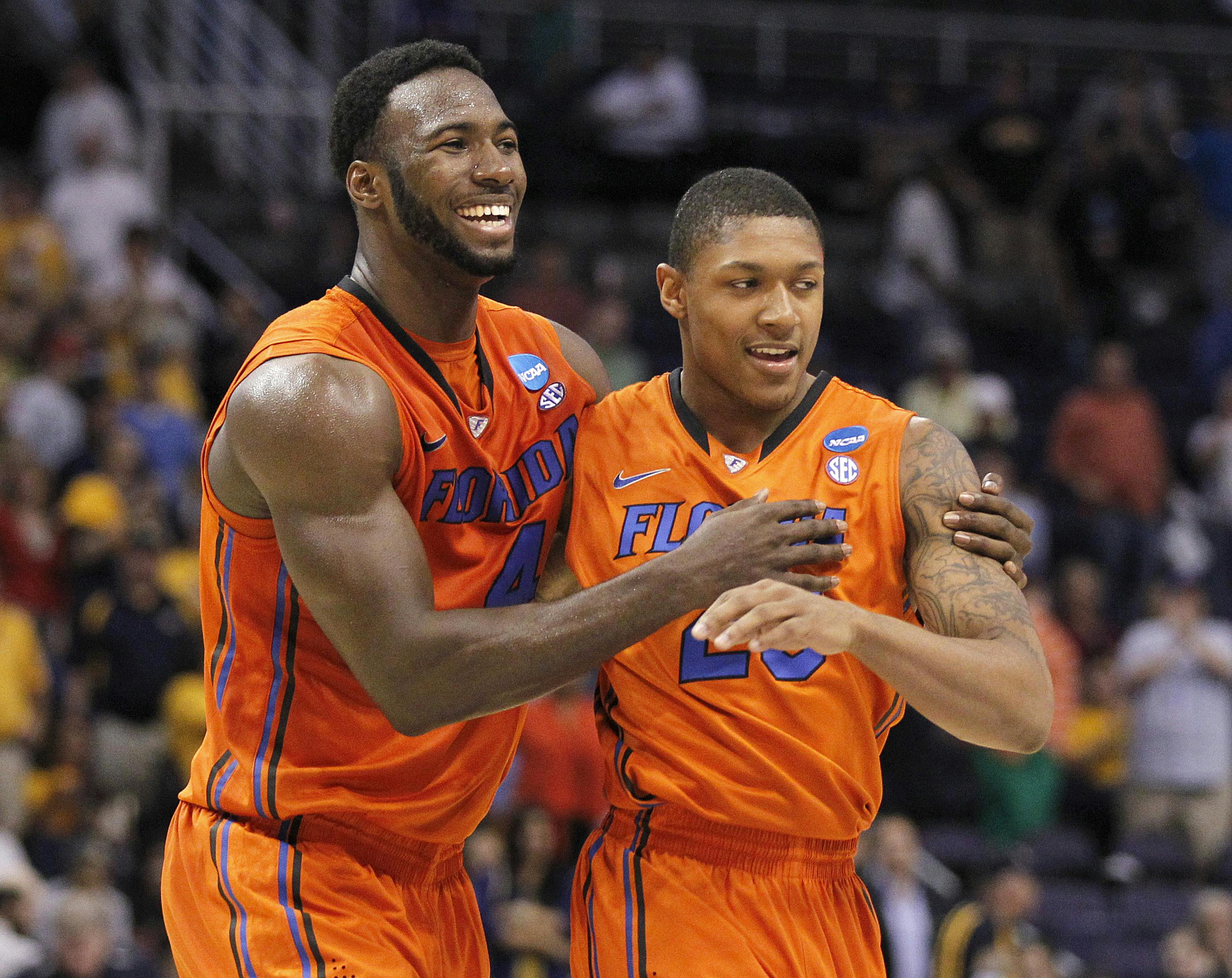 Florida center Patric Young embraces guard Brad Beal during the team’s Sweet 16 meeting with Marquette in 2012.