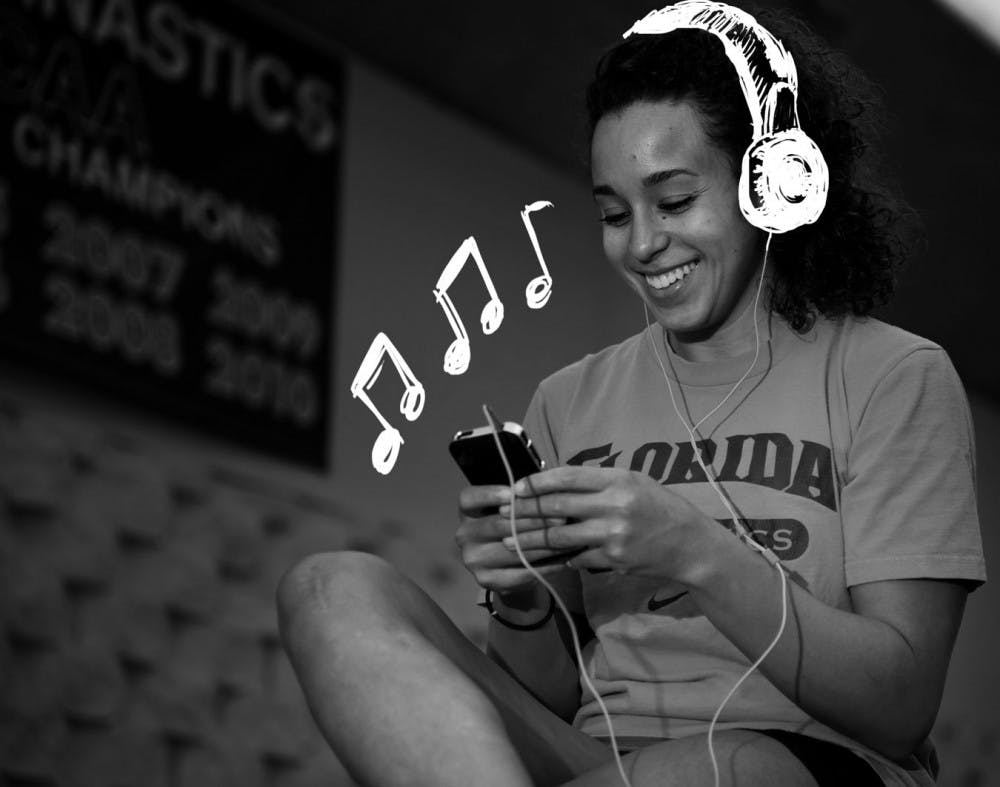 UF gymnast Maranda Smith poses for a photo before practice on Tuesday.  Smith, who does vault and floor exercise, said she pops in her earbuds to help ease routine plane trips.