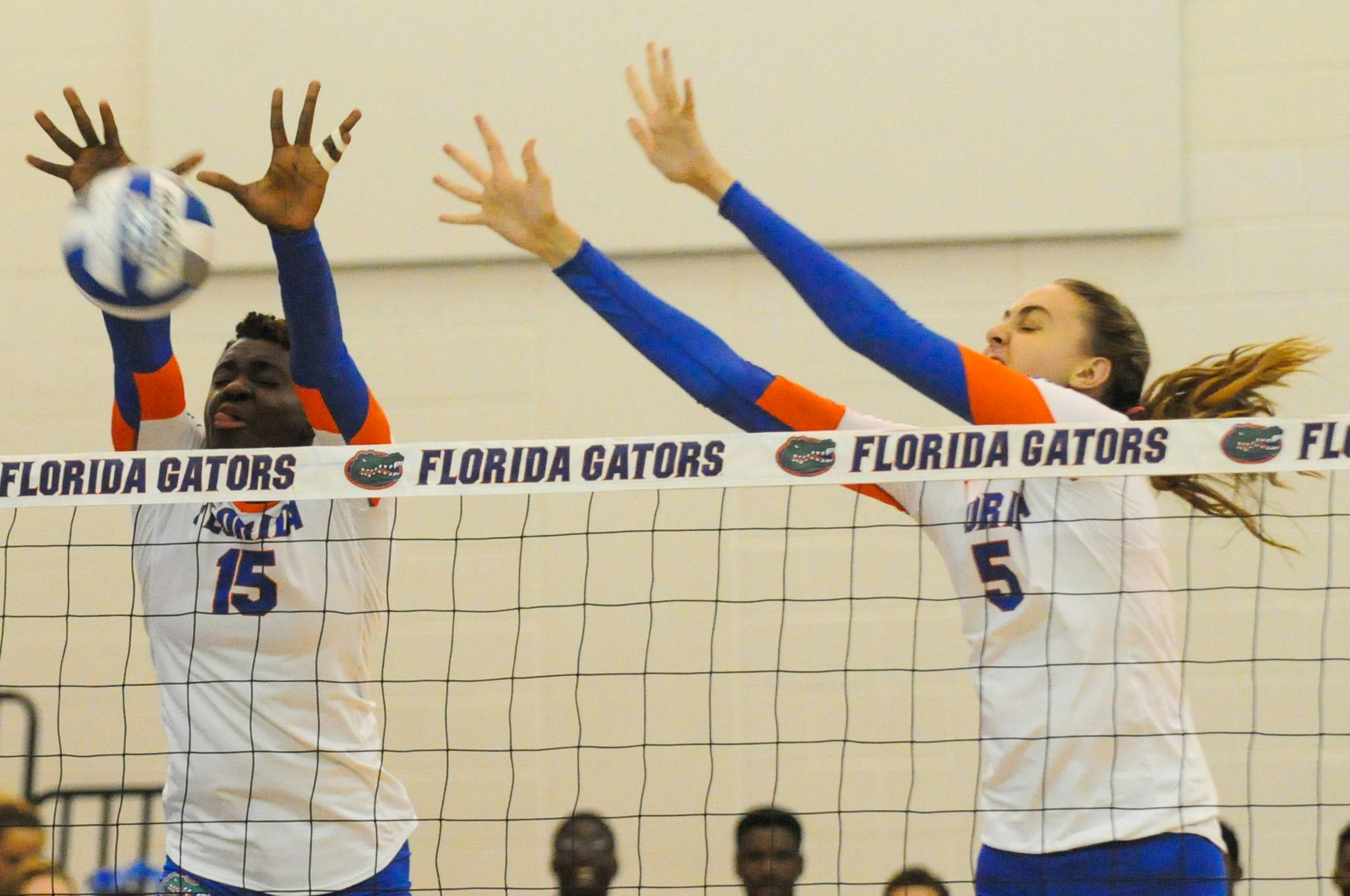 Rachael Kramer (right) attempts a block during Florida's 3-0 win over Jacksonville on Sept. 16, 2016, in the Lemerand Center.