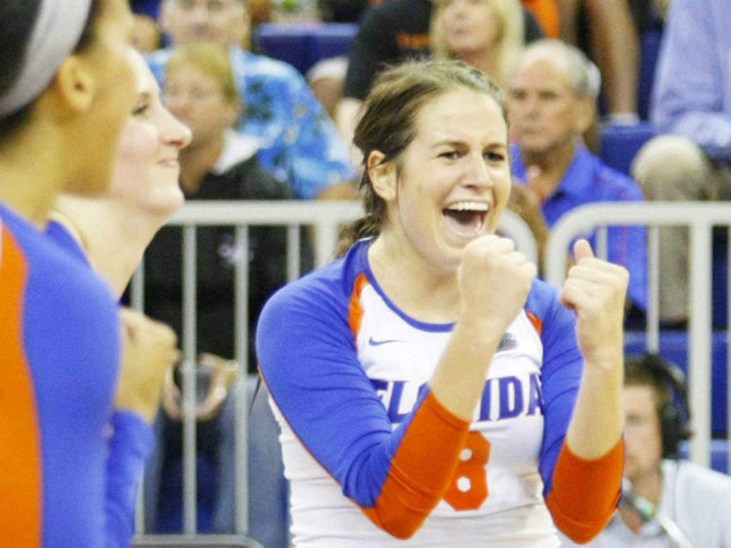 Junior setter Taylor Brauneis (8) celebrates with her teammates during Florida’s 3-0 win against Arkansas on Oct. 5 at the Stephen C. O’Connell Center.