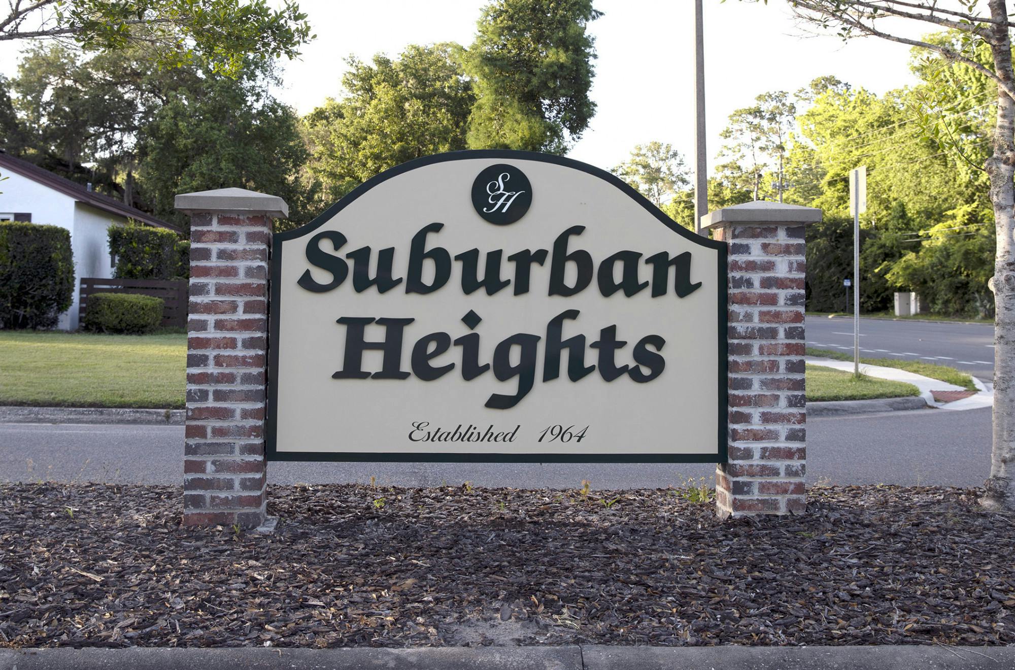 A "Suburban Heights" sign sits at Northwest 23rd Avenue on Thursday, May 20, 2021.