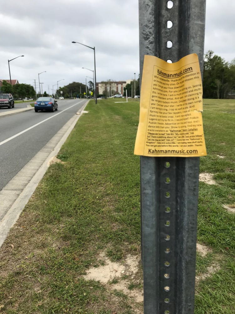Callahan posted these yellow flyers at bus stops across Gainesville to promote his music.