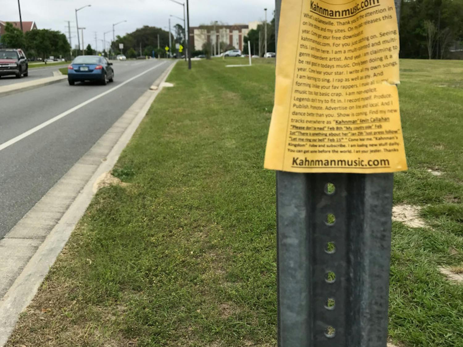 Callahan posted these yellow flyers at bus stops across Gainesville to promote his music.