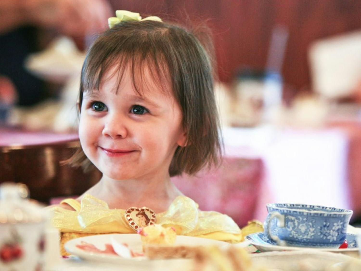 Two-year-old Sydney Partain dressed as a princess and enjoyed tea and sandwiches at Haile Village Bistro’s second Princess and Pirates Tea Party on Saturday.