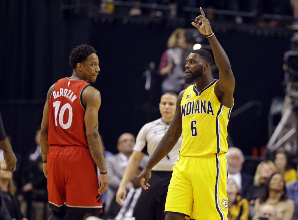 Indiana Pacers forward Paul George (13) celebrates as Toronto Raptors guard DeMar DeRozan (10) watches during the second half of an NBA basketball game in Indianapolis, Tuesday, April 4, 2017. The Pacers defeated the Raptors 108-90. (AP Photo/Michael Conroy)