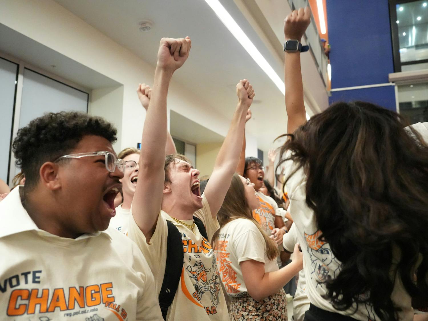 Members of Change Party celebrate their victory in the J. Wayne Reitz Union Student Union on Wednesday, Oct. 4, 2023. 