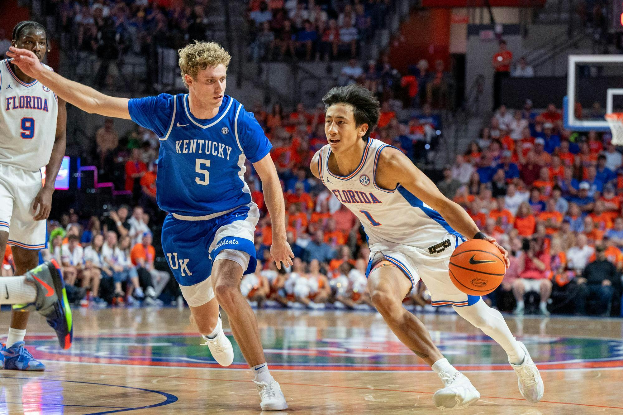 Florida guard Xaivian Lee (1) drives to the basket against Kentucky guard Collin Chandler (5) during the first half of an NCAA college basketball game, Saturday, Feb. 14, 2026 at Exactech Arena in Gainesville, Fla.