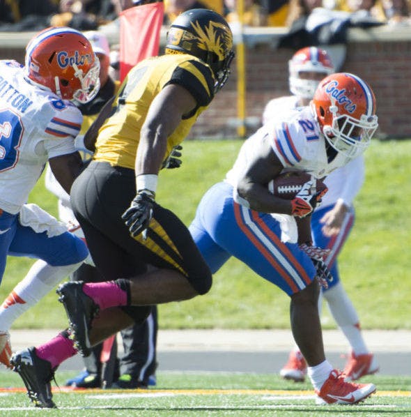 Kelvin Taylor runs the ball during Florida’s 36-17 loss against Missouri on Saturday at Faurot Field in Columbia, Mo. Taylor ran for a 20-yard touchdown in the third quarter.