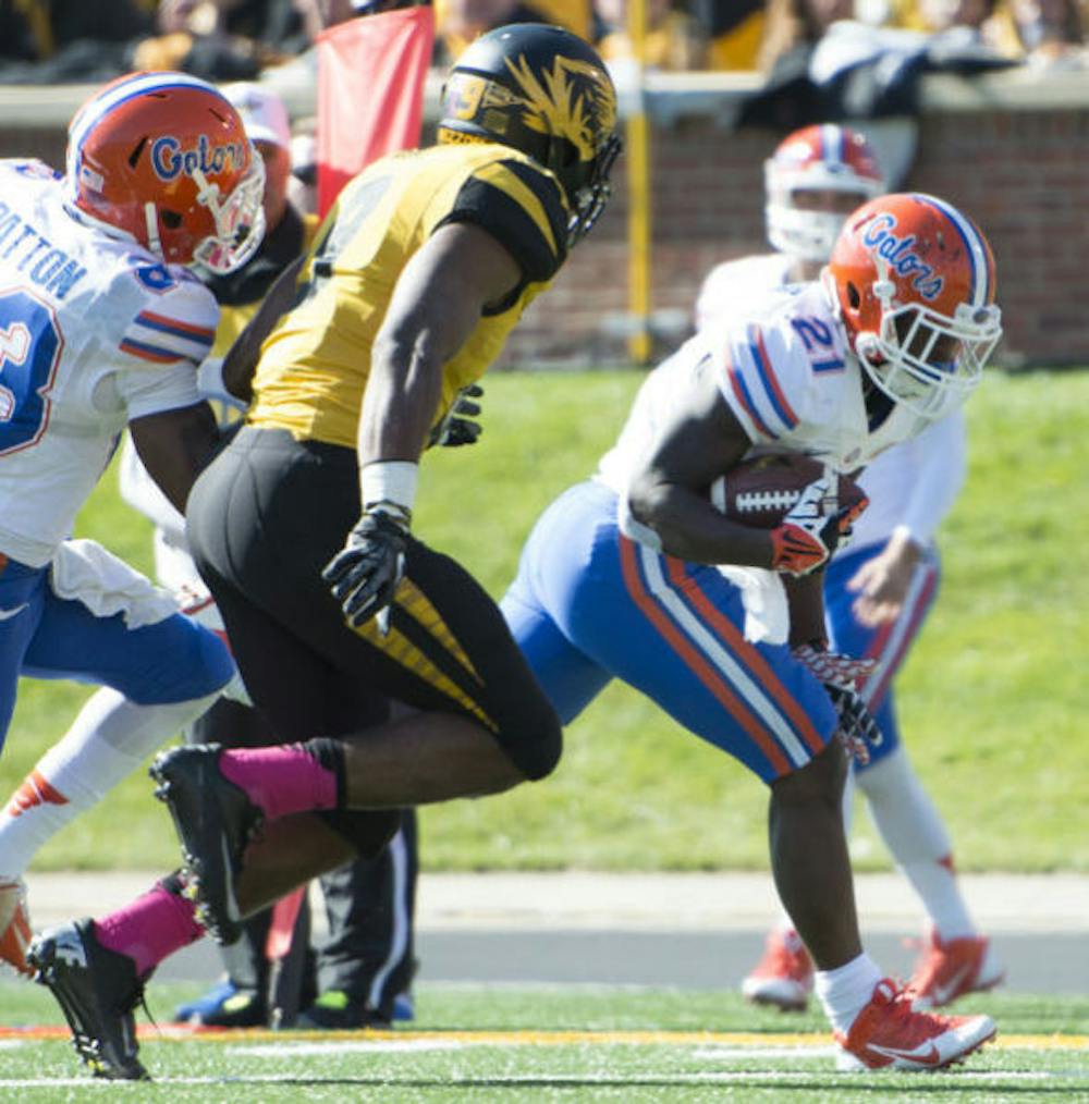 <p>Kelvin Taylor runs the ball during Florida’s 36-17 loss against Missouri on Saturday at Faurot Field in Columbia, Mo. Taylor ran for a 20-yard touchdown in the third quarter.</p>