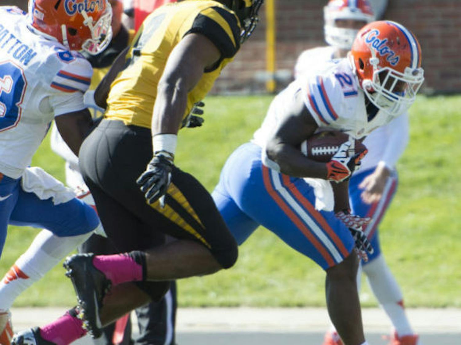 Kelvin Taylor runs the ball during Florida’s 36-17 loss against Missouri on Saturday at Faurot Field in Columbia, Mo. Taylor ran for a 20-yard touchdown in the third quarter.