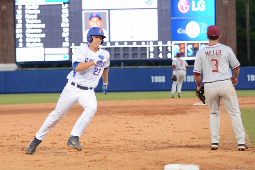 UF's JJ Schwarz runs past third base and heads to score during the first inning of Florida's 13-5 win against Florida State in the NCAA Super Regionals on June 5, 2015, at McKethan Stadium.