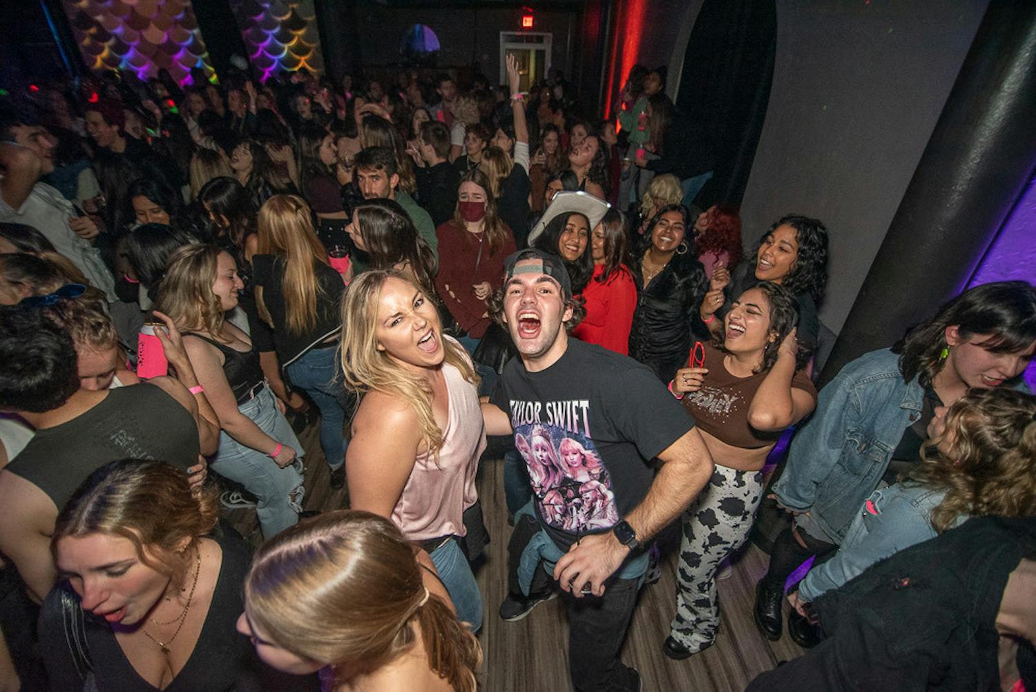 Around 400 attendees, most without masks, partied to Taylor Swift&#x27;s classics at The Wooly&#x27;s Swift-themed dance party Saturday night, Jan. 22.