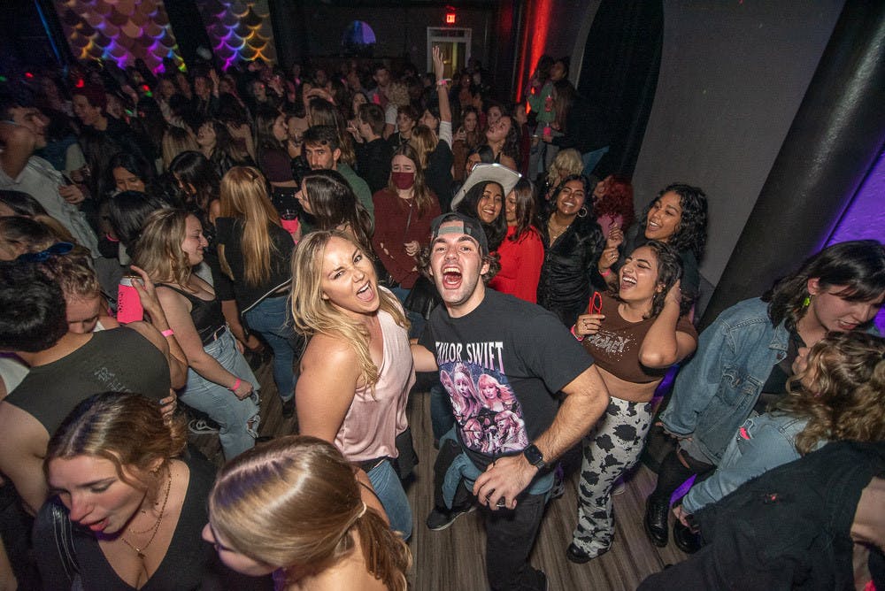 <p>Around 400 attendees, most without masks, partied to Taylor Swift&#x27;s classics at The Wooly&#x27;s Swift-themed dance party Saturday night, Jan. 22.</p>