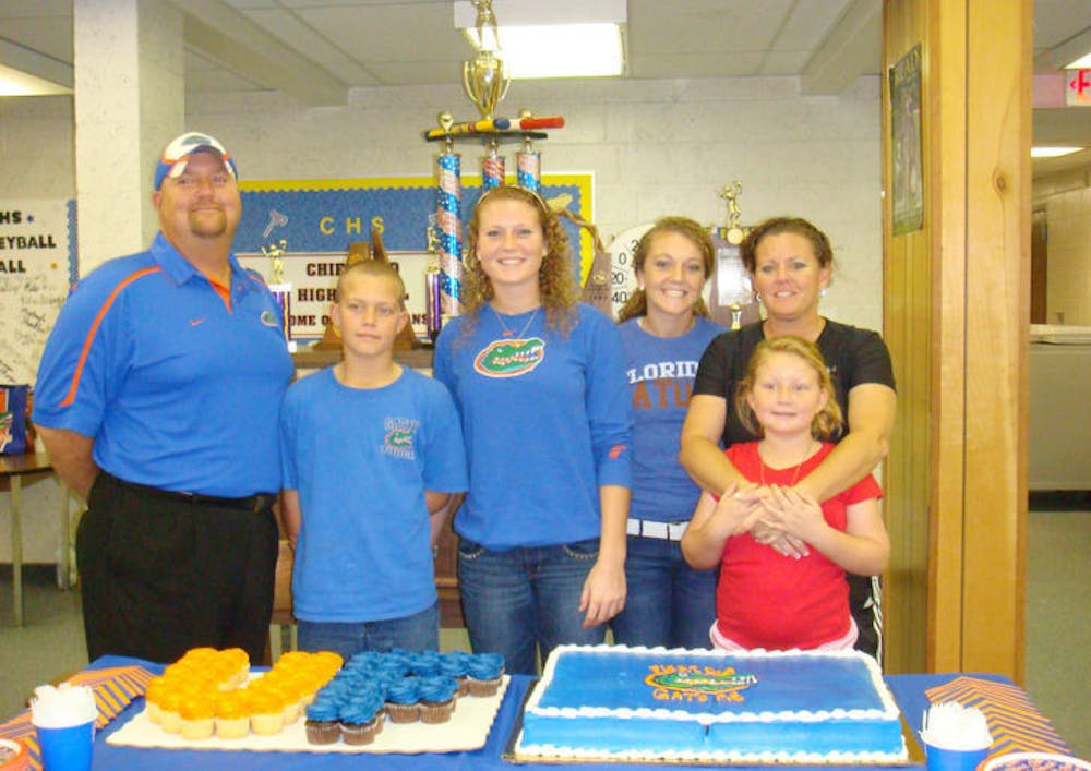 <p>Freshman catcher Taylore Fuller (third from left) was one of three catchers to sign with the Gators in 2012. She will see time behind the plate and in the outfield this year.</p>