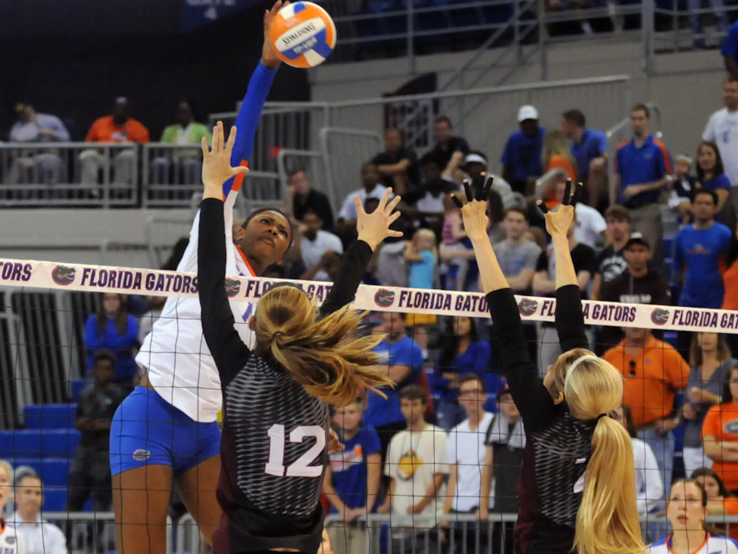 UF middle blocker Rhamat Alhassan swings for a kill during Florida's 3-0 win against Texas A&M on Oct. 9, 2015, in the O'Connell Center.