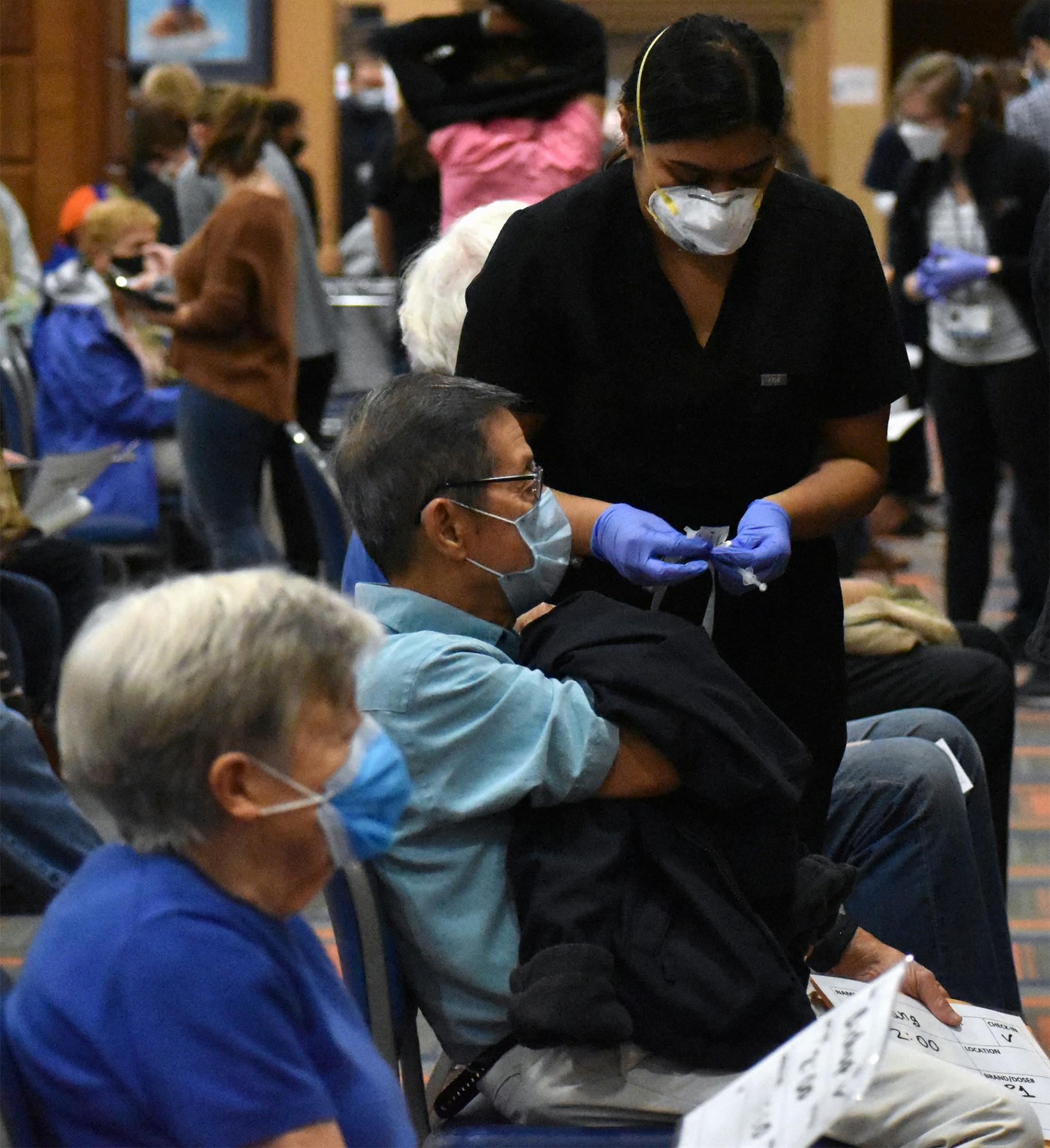 A UF pharmacy student prepares the COVID-19 vaccine before it is administered Friday, Feb.5, 2021.