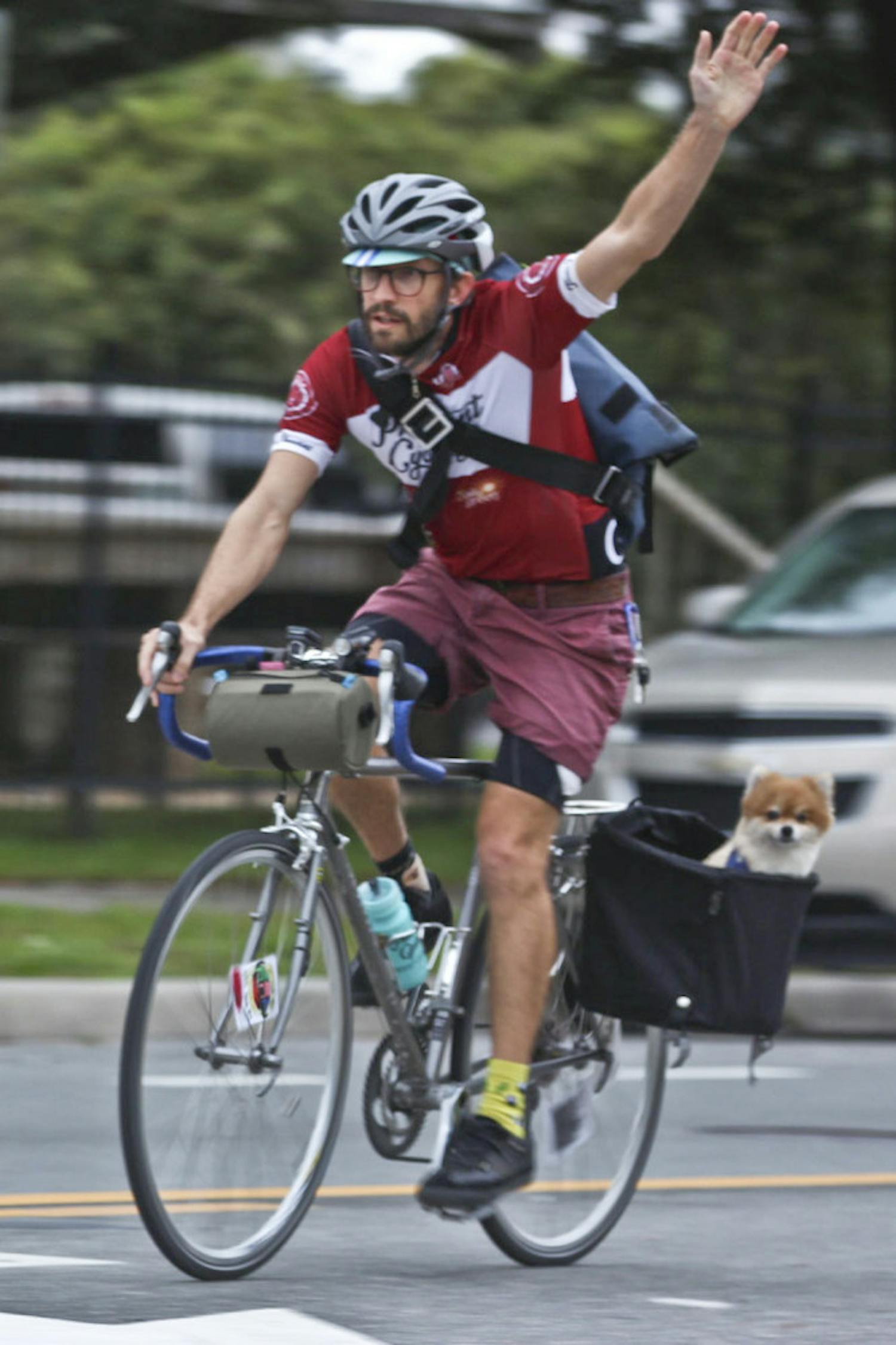 Chris Discenza, a 38-year-old UF coastal engineering graduate student, finishes The Freewheel Project’s third annual Cranksgiving alleycat race with Cauchy, his 7-year-old Pomeranian, on Nov. 22, 2015. “He loves the bike more than anything,” Discenza said. “He was also registered for the race, so I came in 25th and he technically came in 26th.”