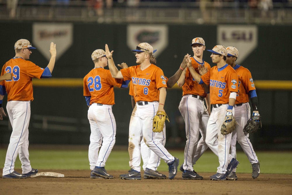 <p>Florida players celebrate following the Gators' 10-2 victory against Miami in the NCAA Men's College World Series on Wednesday, June 17, 2015 at TD Ameritrade Park in Omaha, Nebraska</p>