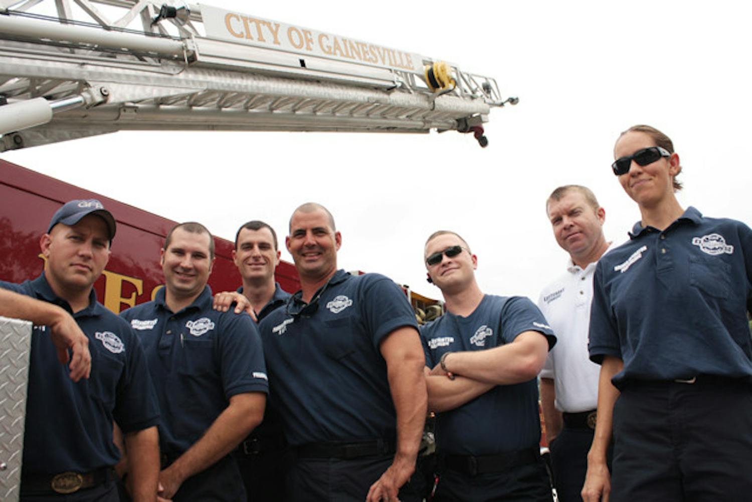 Firefighters from B shift at Station 1,427 S Main St., pose with "Quint," their backup aerial fire truck. Firefighters said they have the utmost respect for law enforcement officers who lost their lives on Sept. 11, 2001.