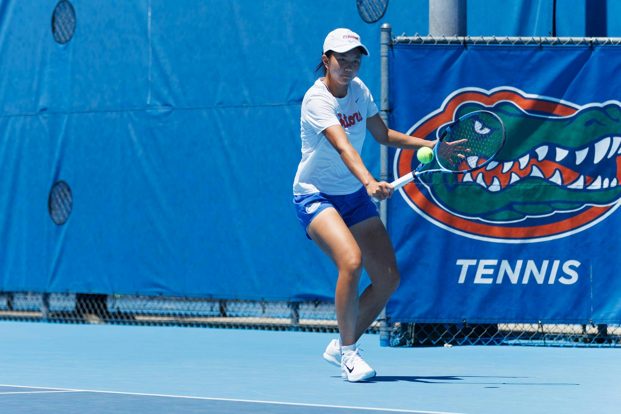 Florida's Xinyi Nong retunrs the ball during an NCAA women’s doubles tennis match against Missouri, Sunday, April 12, 2026, in Gainesville, Fla.