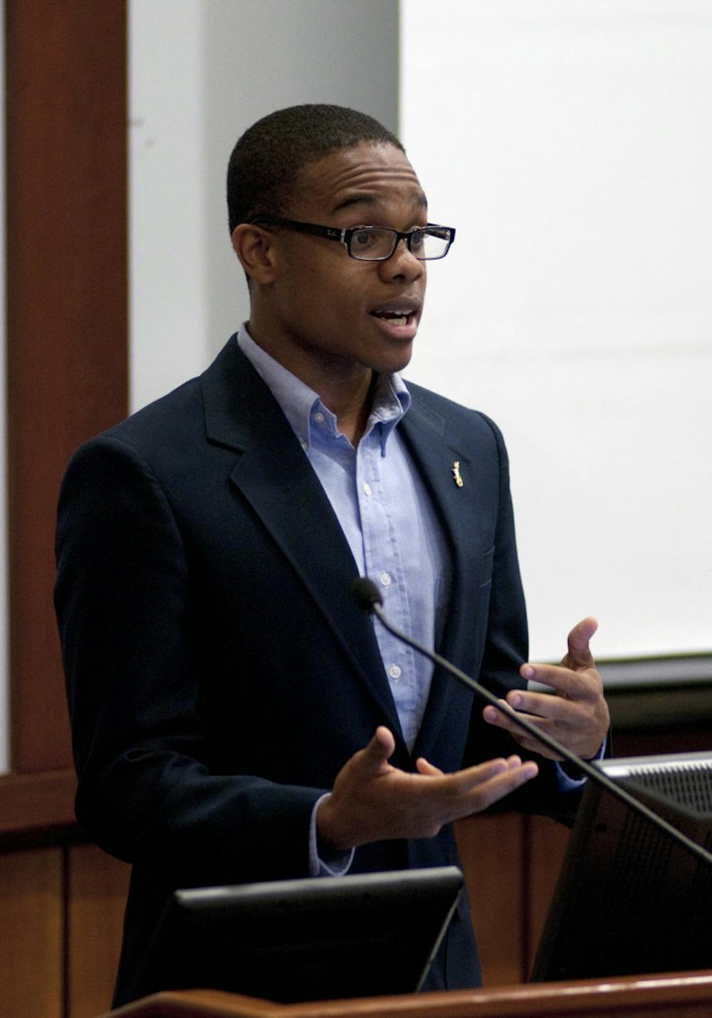 <p>Black Student Union President Dekendrick Murray speaks in support of tuition equity Tuesday evening.</p>