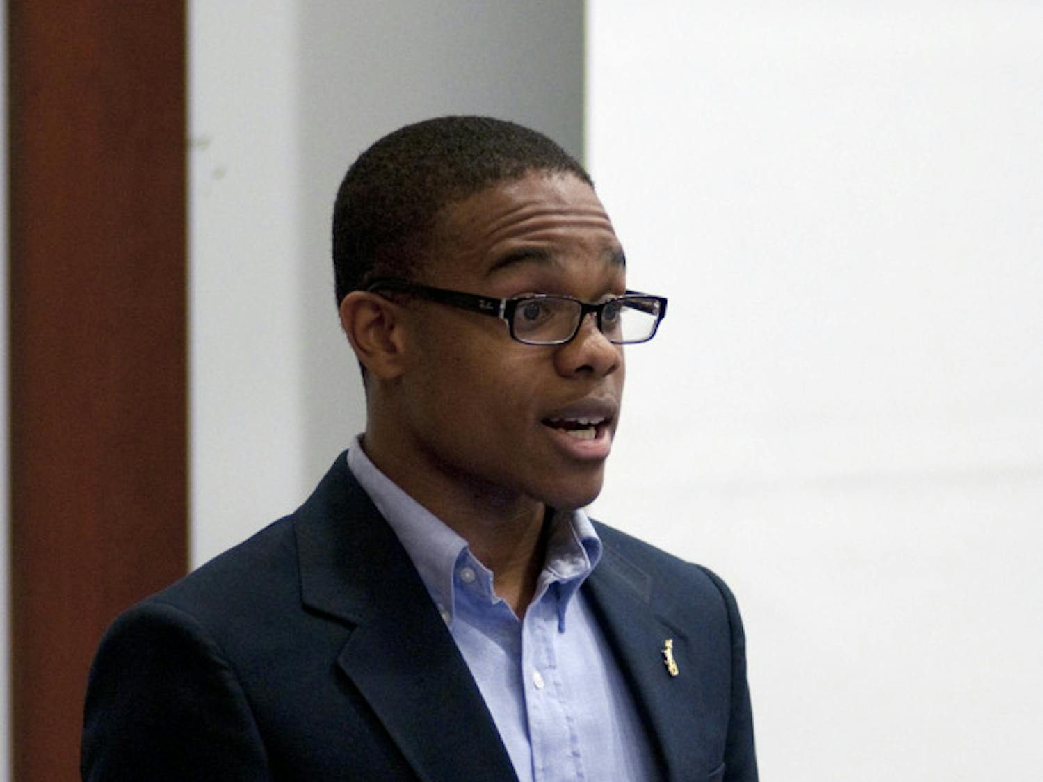 Black Student Union President Dekendrick Murray speaks in support of tuition equity Tuesday evening.