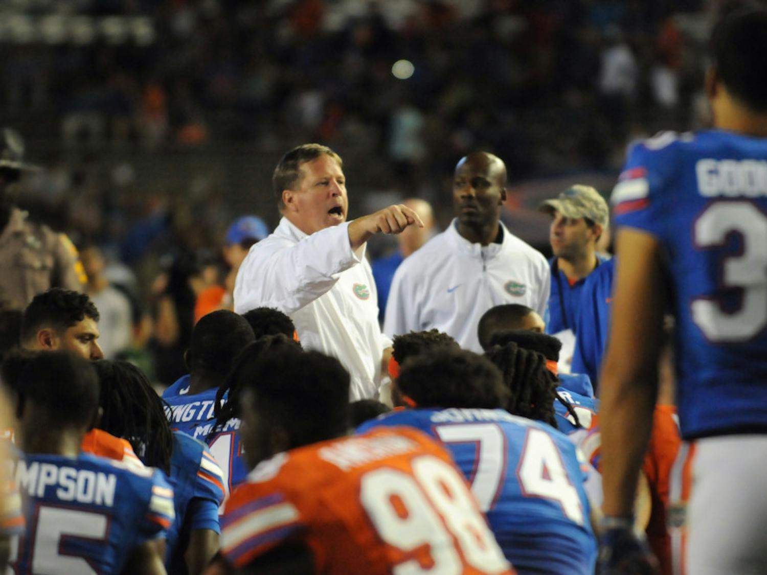 UF coach Jim McElwain talks with his team following the Orange & Blue Debut on April 8, 2016, at Ben Hill Griffin Stadium.