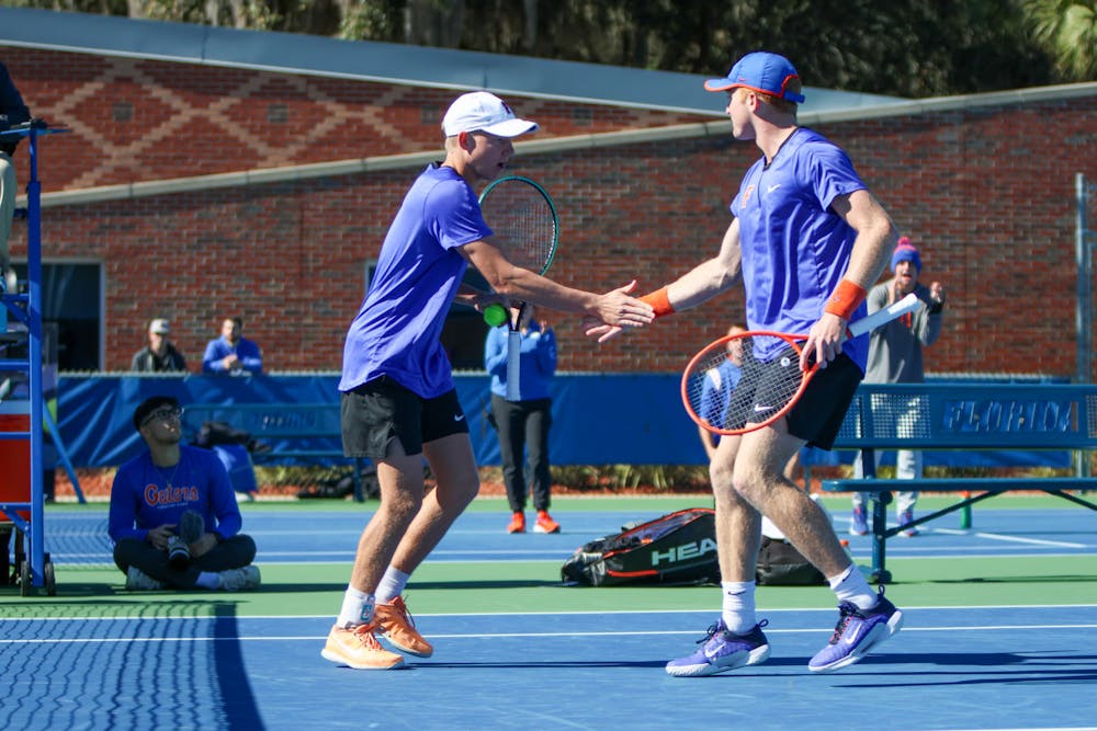 Florida senior Lukas Greif and freshman Jonah Braswell celebrate during their doubles match in the Gators' 5-2 loss to the No. 8 Texas Longhorns Sunday, Jan. 15, 2023.