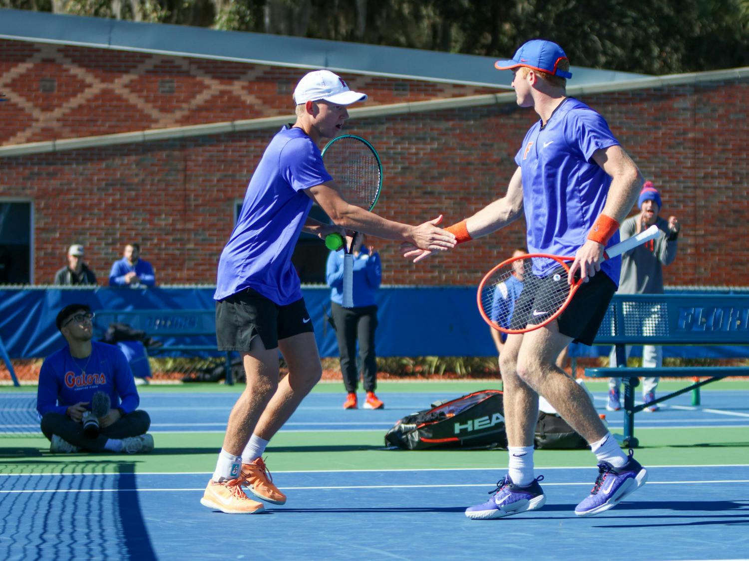 Florida senior Lukas Greif and freshman Jonah Braswell celebrate during their doubles match in the Gators' 5-2 loss to the No. 8 Texas Longhorns Sunday, Jan. 15, 2023.