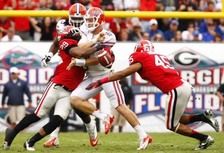 Sophomore quarterback Jeff Driskel (6) loses possession of the ball while being sacked by Georgia linebacker Jarvis Jones (29) during Florida’s 17-9 loss on Saturday at EverBank Field in Jacksonville.
