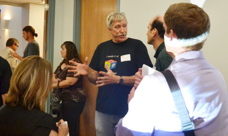 Mark Davidson, president of Florida Tech Toybox Inc., speaks with open-house attendees Wednesday. The event celebrated the company’s launch and asked for financial backers in its Indiegogo campaign.