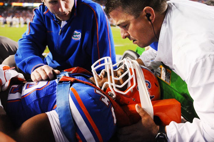 Gators sophomore linebacker Darrin Kitchens is carted off the field during the third quarter of Saturday’s loss to the Seminoles after suffering an injury during a kickoff return.