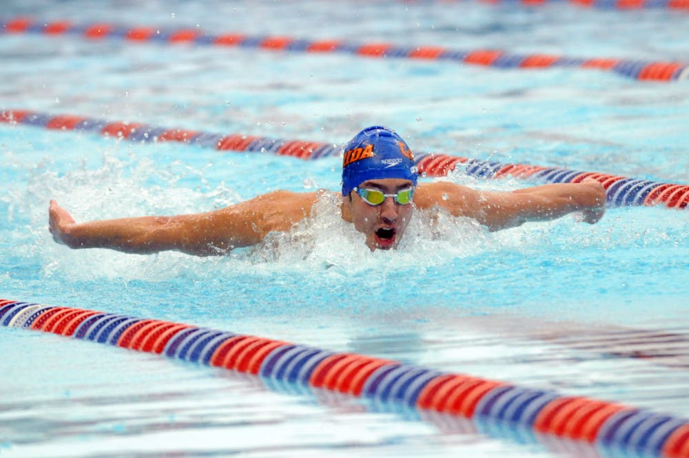 <p>Alex Lebed races in the 200 meter butterfly during Florida’s meet against Auburn on Jan. 23, 2016, in the O’Connell Center.</p>
