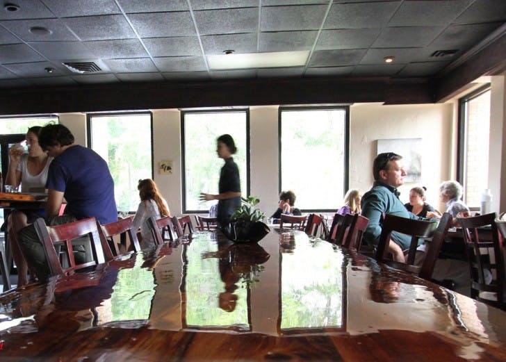 Patrons attend the official opening Tuesday afternoon at The Jones B-side at 203 W Second Ave. The menu includes the Canadian dish poutine, which includes hand-cut fries and gravy for $7.95.