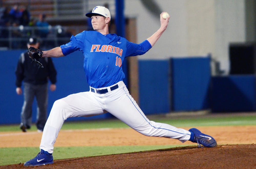 <p>A.J. Puk pitches during Florida's 7-2 loss to Miami on Feb. 21 at McKethan Stadium.</p>