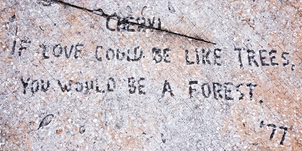 The inscription of a poem dedicated to a person named Cheryl is displayed in front of the steps of Matherly Hall. It was investigated and discussed in a podcast called 'Cheryl '77.' 