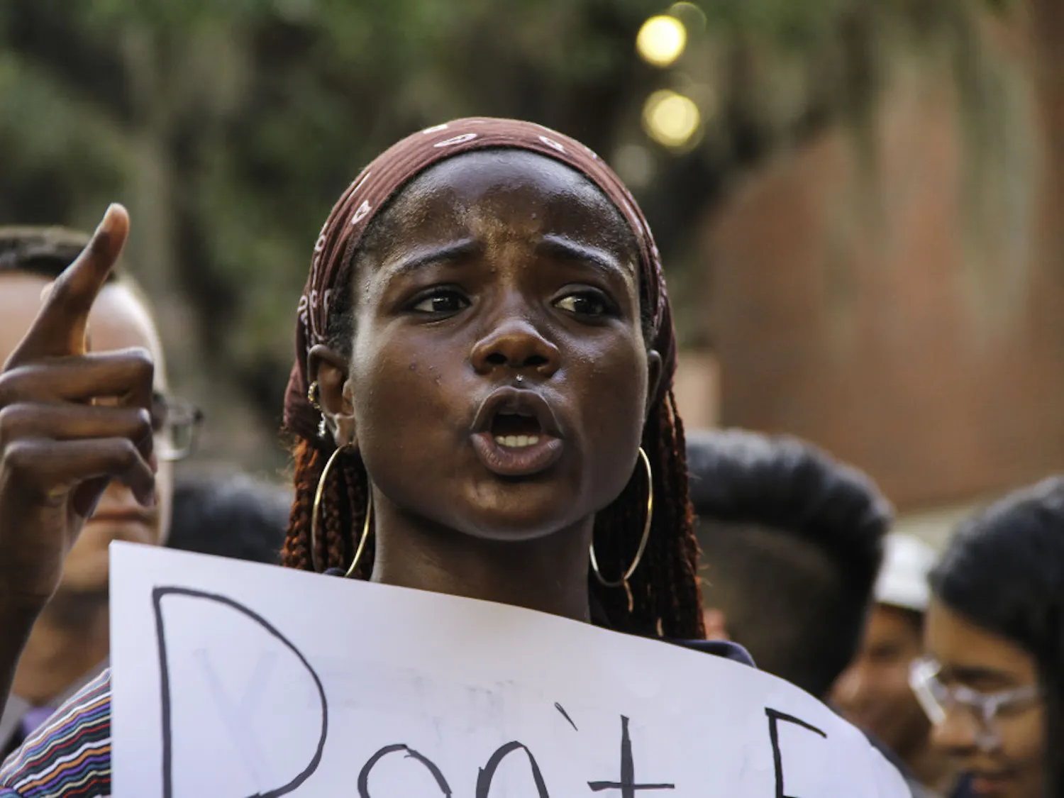 Jamie Douglas, an 18-year-old UF telecommunication sophomore, chants in solidarity with Iranian and Iraqi people at an anti-war demonstration on Turlington Plaza Wednesday afternoon.