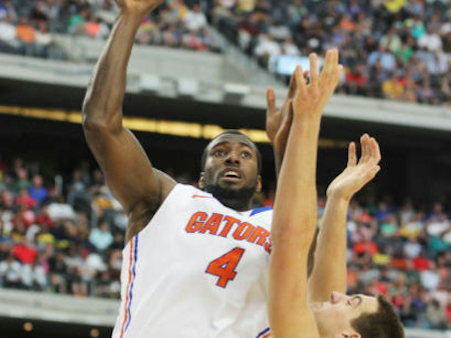 Center Patric Young attempts a shot during Florida’s 79-59 Elite Eight loss to Michigan on March 31 in Arlington, Texas.