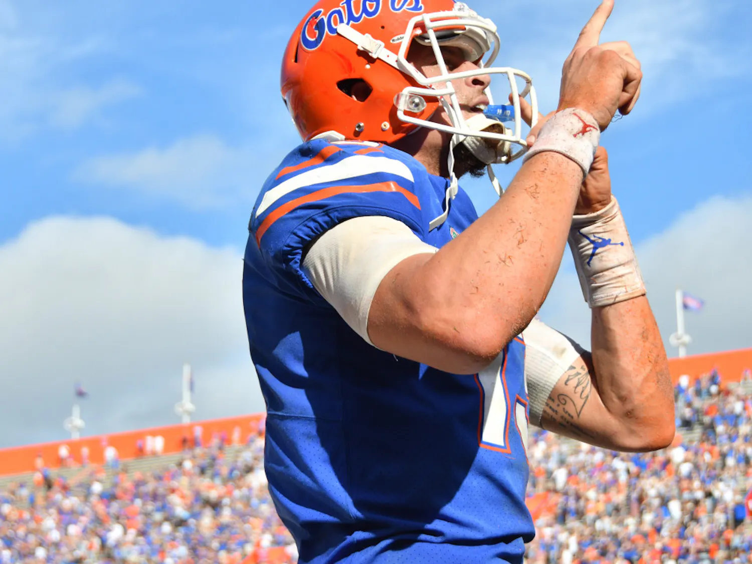 Quarterback Feleipe Franks shushes the home crowd at The Swamp after his second rushing touchdown against South Carolina on Saturday.