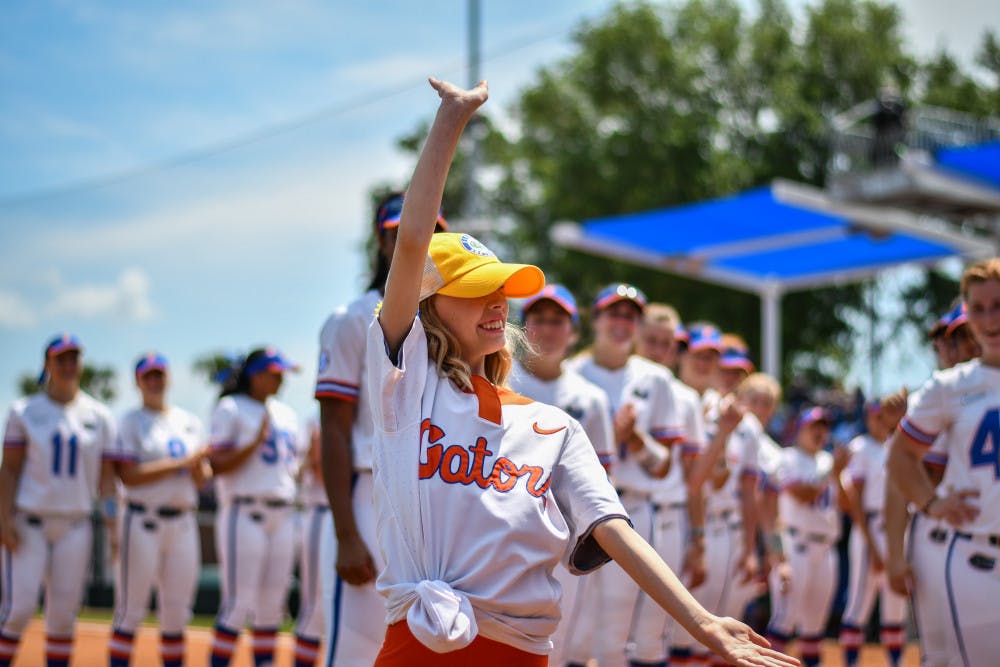 Hartley Georges is introduced with the UF softball team during its game against Arkansas on April 7. Georges has been an honorary member of the team since November.